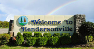 Welcome to Hendersonville City welcome sign with rainbow